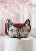 Bolso convertible en mochila *Plumage Bordeaux*. Pieza única hecha a mano. Num 97